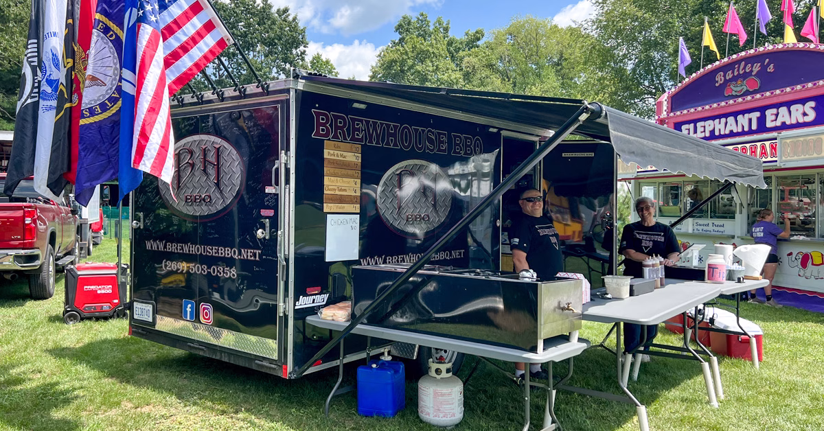 Brewhouse BBQ Food Truck with flags from various US armed forces.