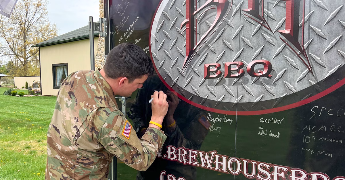 A US veteran signing the Brewhouse BBQ Food Truck